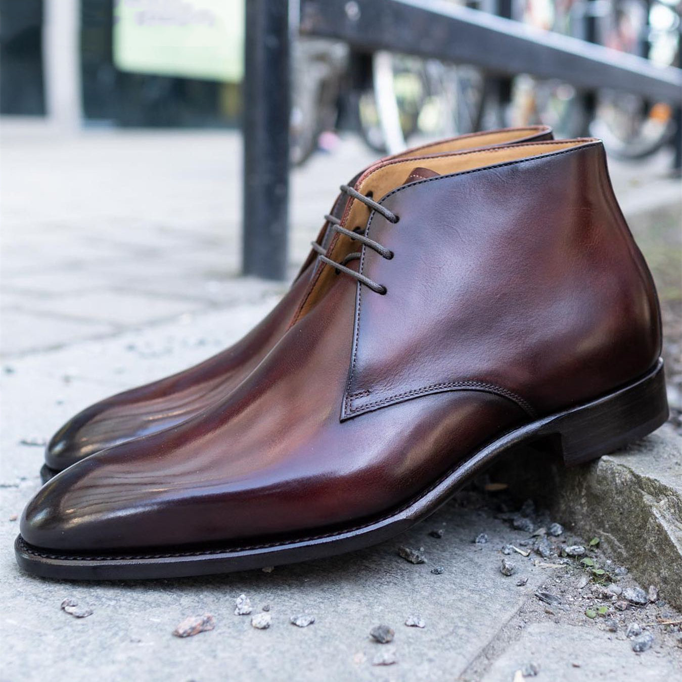 red-brown glossy pointed-toe chukka boots