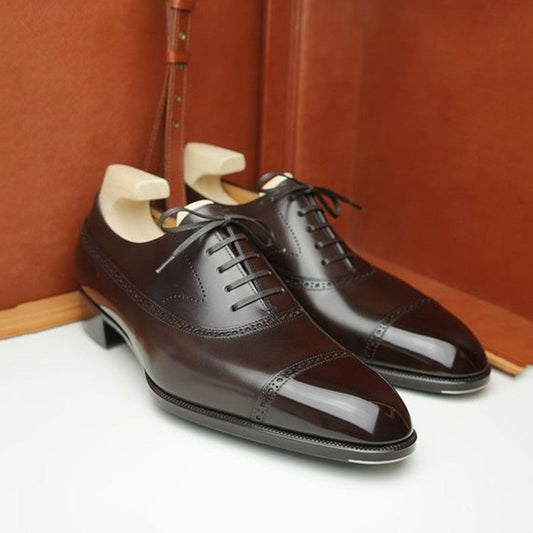 Brown classic brogue style lace-up Oxford dress shoes